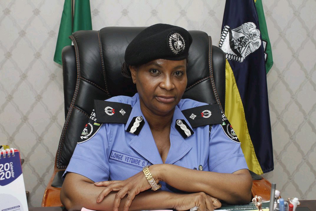 The police raise the woman to the same rank three months after the husband retired as an AIG.