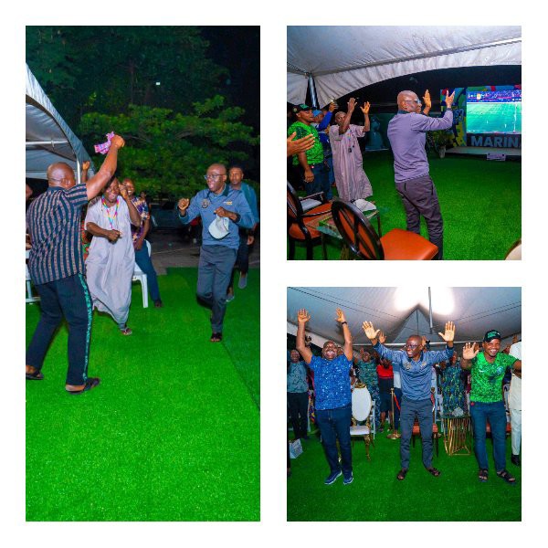 Pictures of the Lagos State governor at a viewing center, celebrating the Super Eagles' victory over Cameroon